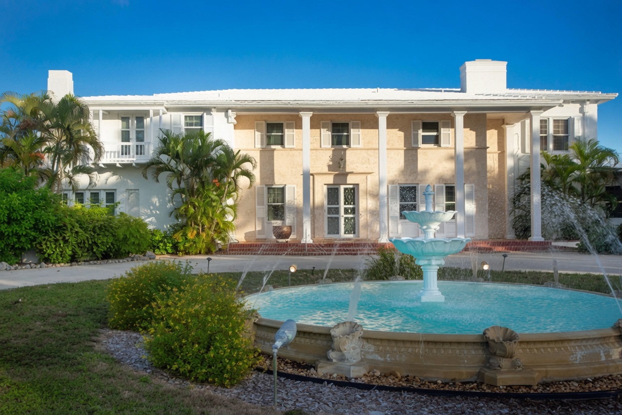 Front facade of the historic Thompson Island estate with tiered fountain